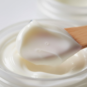 Close-up of a rich and nourishing white cream texture for effective makeup removal without irritation.