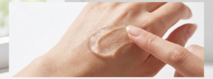 Transparent fruit acid peeling gel texture spread on hand showing product consistency in fruit acid peeling gel benefits tutorial